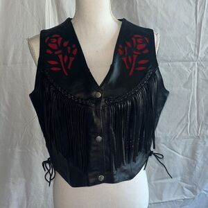 Interstate leather ￼Black Leather Fringe Vest with Rose Inlay on front and back.